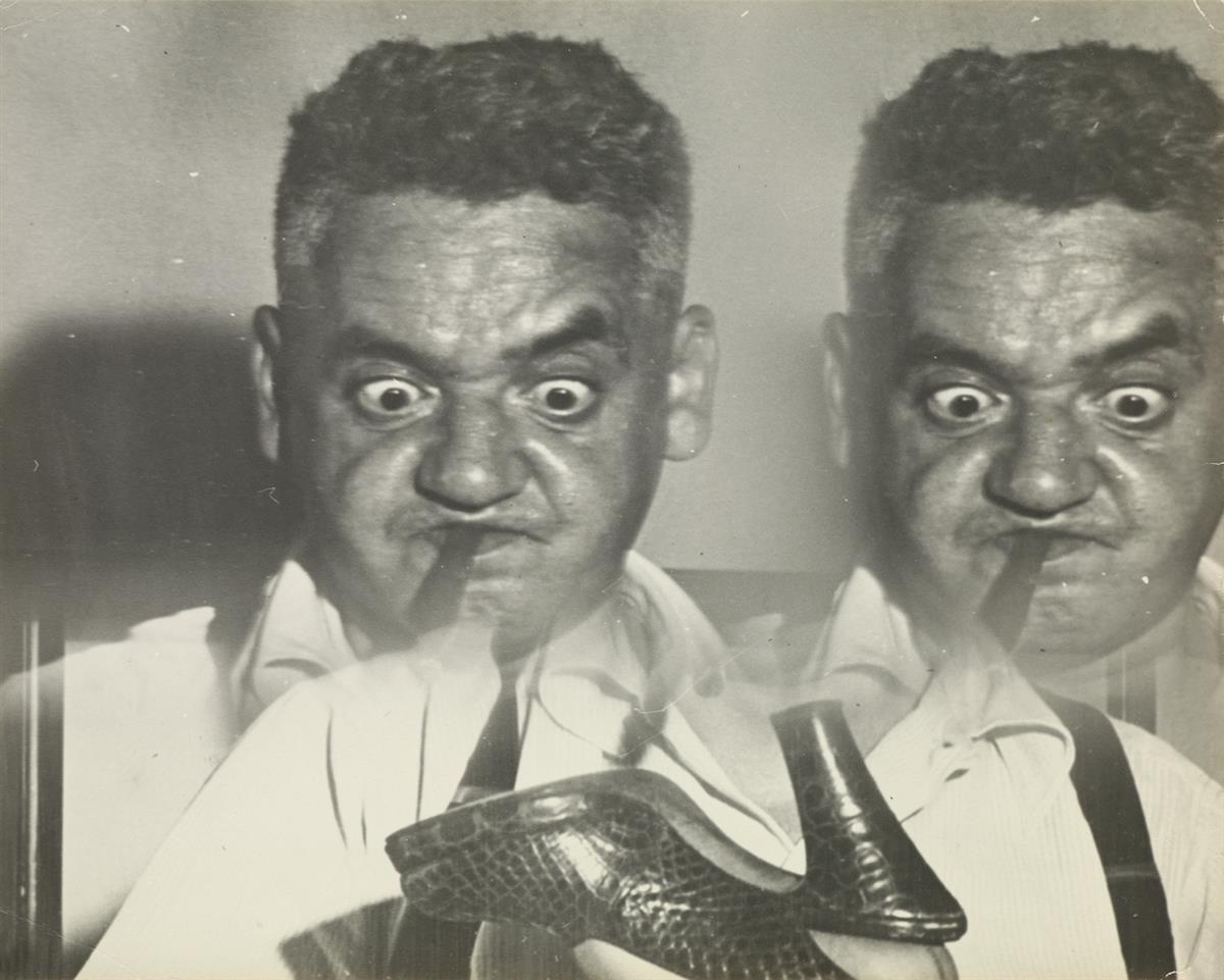 WEEGEE [ARTHUR FELLIG] (1899-1968) Distortion (double self-portrait with womans shoe).